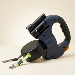 Navy retractable double dog leash with LED flashlight on an ivory background